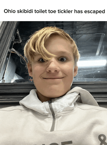 a picture of a young boy with the caption ohio skibidi toilet toe ticker has escaped