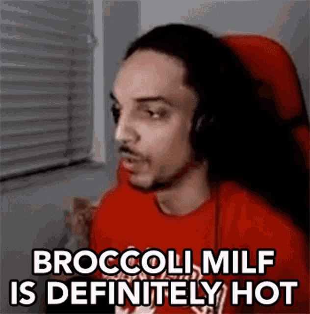 a man wearing headphones is sitting in front of a window and says broccoli milf is definitely hot .
