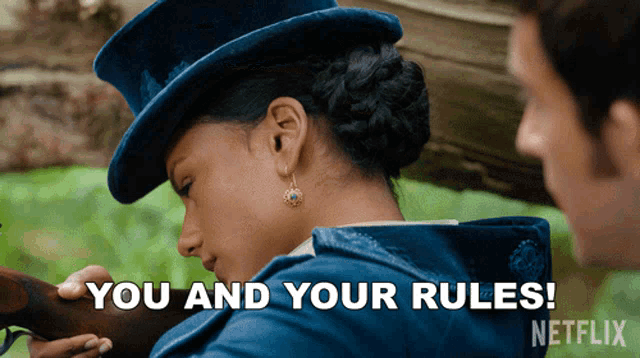 a woman in a top hat is holding a gun with the words you and your rules written below her