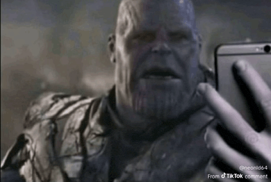 thanos is taking a selfie with his cell phone
