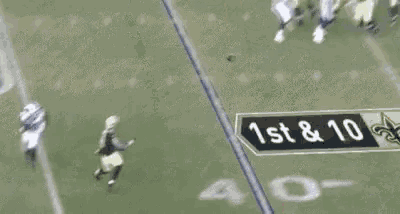 a football player with the number 47 on his jersey is running on the field .