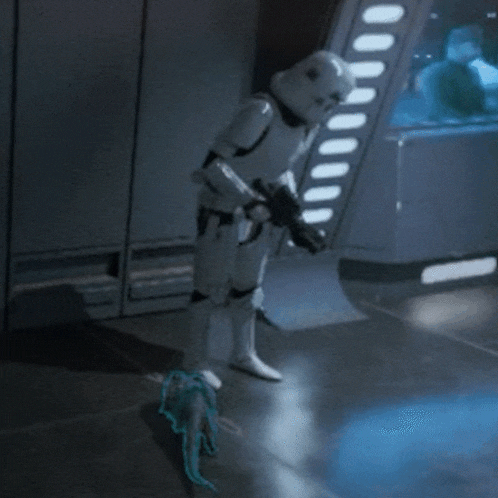 a storm trooper is standing in a room with a gun