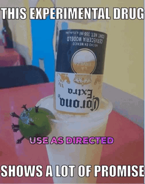 a bottle of corona extra beer in a cup