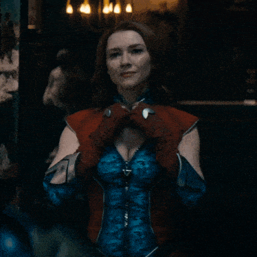 a woman in a blue and red superhero outfit