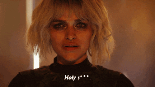 a close up of a woman 's face with the words holy s * * written on the bottom