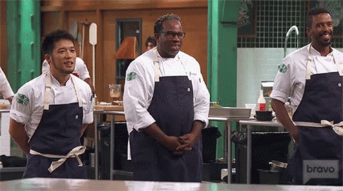 Laughing Top Chef GIF - Laughing Top Chef Shrug GIFs