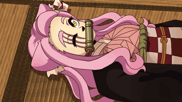 a cartoon of a girl with pink hair laying on a mat
