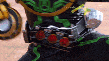a person wearing a belt that says tv asahi on the bottom