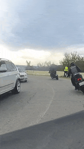 a man riding a motorcycle with a license plate that says ' rj - lcs ' on it
