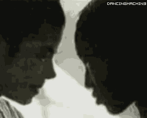 two people are looking at each other and the words dancingmachine are on the bottom