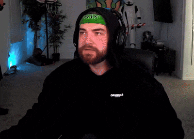 a man wearing headphones and a black hoodie with the word original on the front