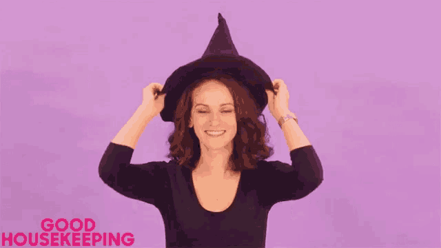 a woman is wearing a witch hat with the words good housekeeping written on the bottom