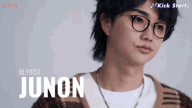a young man with glasses and the name junon on the bottom