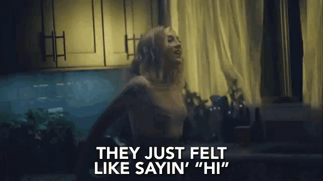 a woman is dancing in a kitchen with the words they just felt like saying hi