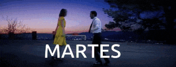 a man and a woman are walking in front of a sign that says " martes "
