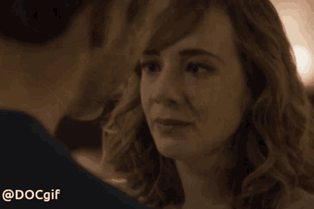 a man and a woman are looking into each other 's eyes with the hashtag @dcgif