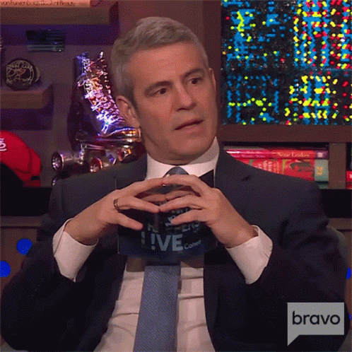 Looking Up And Down Andy Cohen GIF - Looking Up And Down Andy Cohen Watch What Happens Live With Andy Cohen GIFs