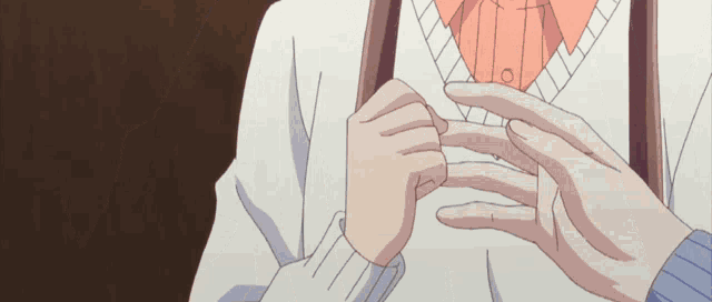 a close up of a person 's hands with a white shirt