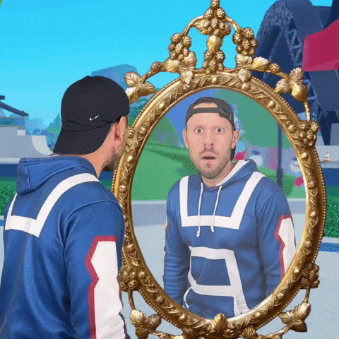 a man looking at his reflection in a mirror wearing a blue and white hoodie