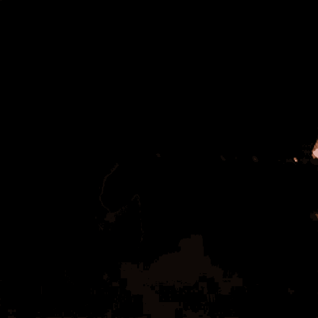 a shirtless man is standing in the dark with his eyes closed