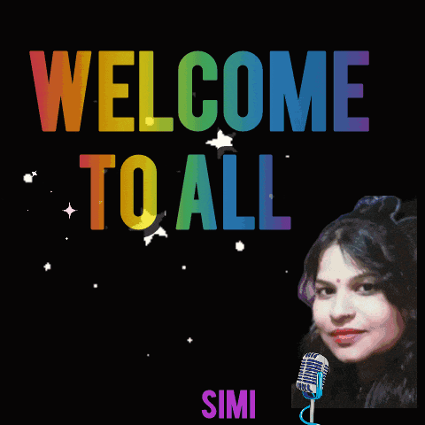 a colorful welcome to all sign with flowers and a woman behind a microphone