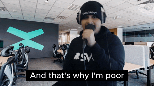 a man singing into a microphone with the words and that 's why i 'm poor