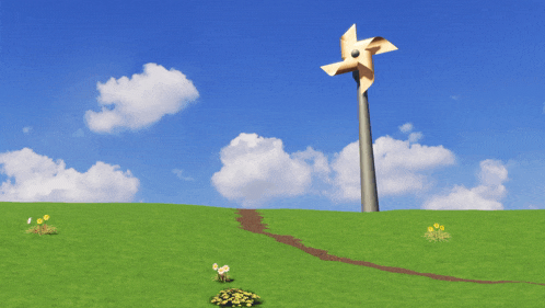 a windmill in the middle of a grassy hill