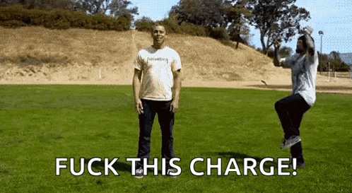 two men standing in a grassy field with the words " fuck this charge " on the bottom