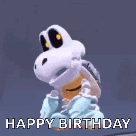 a happy birthday gif with a skeleton turtle in a sweater .