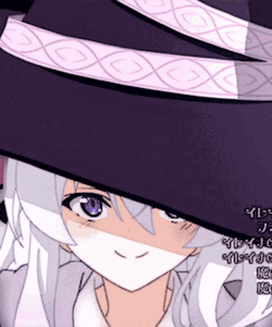 a close up of a girl wearing a purple hat with a pink ribbon