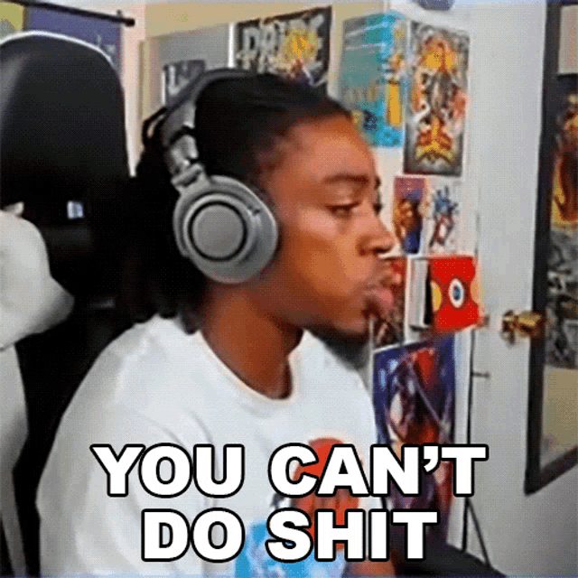 a man wearing headphones says " you can 't do shit " while sitting in a chair