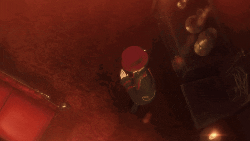 a man in a red top hat is laying down
