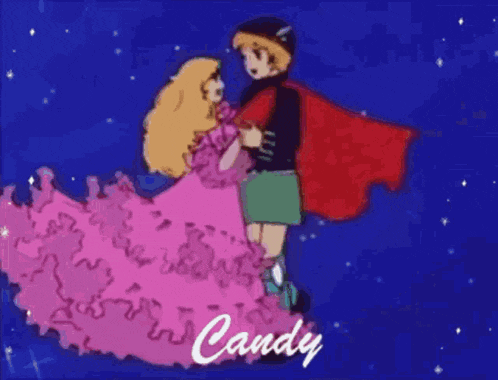 a boy in a red cape is holding a girl in a pink dress in his arms .
