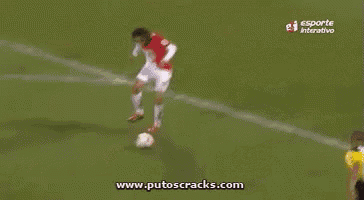 a soccer player with the number 8 on his shirt is being tackled by another player