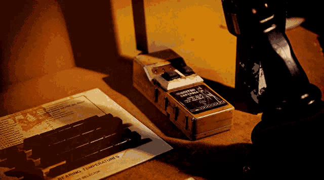 a box that says " bearing temperatures " is on a table