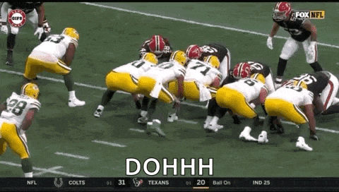 a group of football players are getting ready to play a game on a field .
