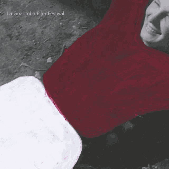 a poster for the la guarimba film festival shows a man laying on the ground