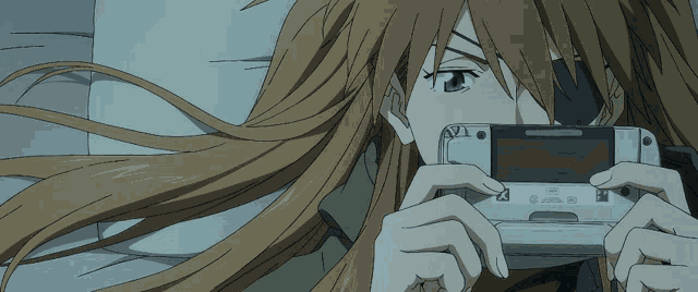 a girl with long hair is holding a device that says nintendo on it