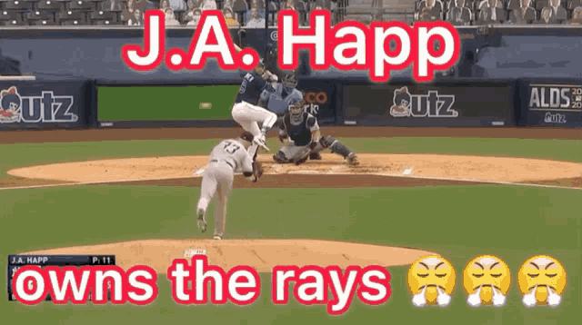 j.a. happ owns the rays is written on a baseball field