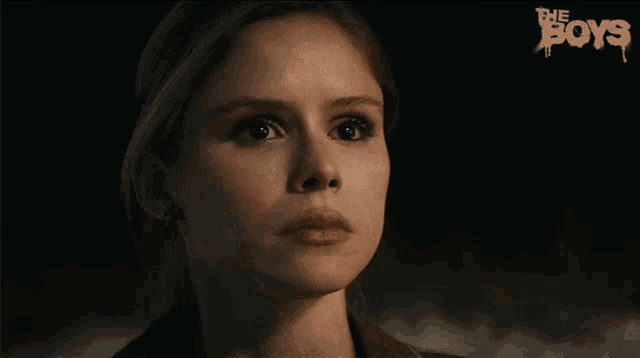 a close up of a woman 's face with the words " the boys " in the background