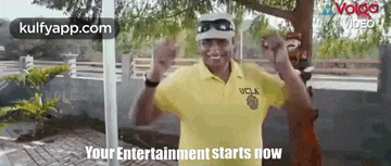 a man in a yellow shirt with the words your entertainment starts now on the bottom .