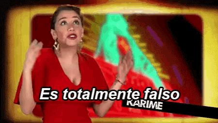 a woman in a red dress stands in front of a screen that says es totalmente falso karime