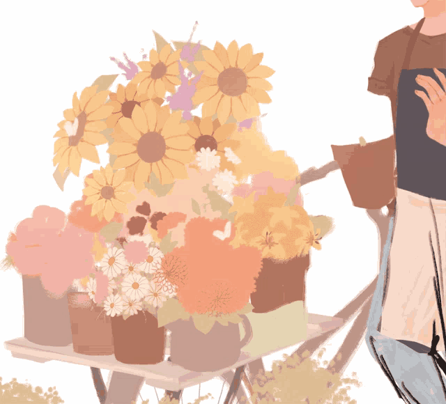 a bunch of flowers are on a table with a person standing behind them