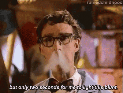 a man wearing glasses and a bow tie is smoking a cigarette and says but only two seconds for me to light this blunt