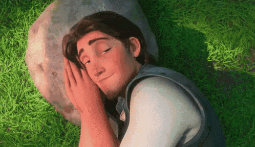 a cartoon character is laying on the grass with his eyes closed and his hands on his face .