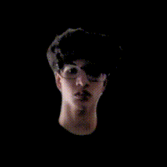 a blurry picture of a person 's face with glasses on