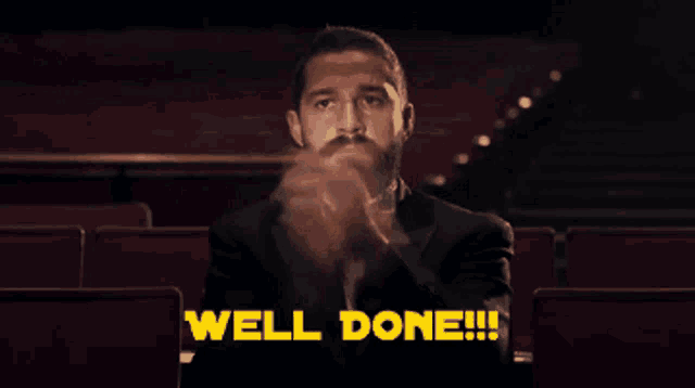 a man in a tuxedo and bow tie applauds with the words well done written above him