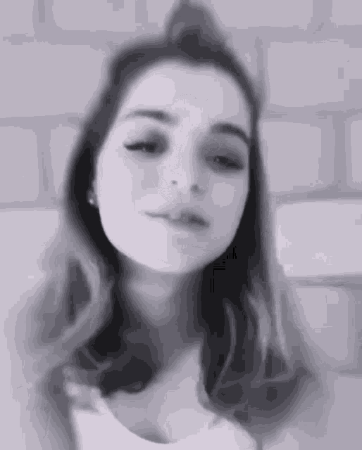 a black and white photo of a woman 's face