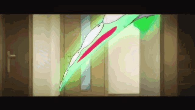 a cartoon drawing of a green leaf with a red stripe on it