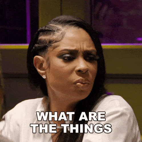 a woman making a funny face with the words what are the things above her
